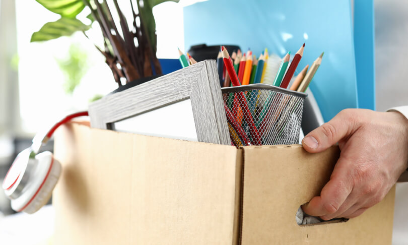 Man holding a box after quitting job